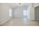 Bedroom with neutral walls and wood floors and modern lighting fixture at 5210 Davenport Pl, Roswell, GA 30075