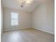 Vaulted ceiling in light-filled bedroom with ceiling fan and large window at 5210 Davenport Pl, Roswell, GA 30075