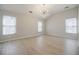 Spacious bedroom with vaulted ceiling, hardwood floors and neutral paint at 5210 Davenport Pl, Roswell, GA 30075