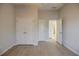 Bedroom with neutral paint, closet and connecting doors, and modern flooring at 5210 Davenport Pl, Roswell, GA 30075