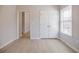 Bright bedroom with light floors, closet, lots of natural light and entry to hallway at 5210 Davenport Pl, Roswell, GA 30075