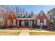 Beautiful brick clubhouse with dormer windows and a covered front porch at 5210 Davenport Pl, Roswell, GA 30075