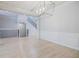 Dining area with modern lighting, wainscoting, and view of the staircase at 5210 Davenport Pl, Roswell, GA 30075