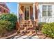 Brick front steps with iron railings leading to the front door of the red brick home at 5210 Davenport Pl, Roswell, GA 30075