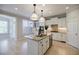 Elegant kitchen with white cabinets, granite countertops, stainless steel appliances, and center island at 5210 Davenport Pl, Roswell, GA 30075