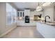 Bright, modern kitchen with stainless appliances, white cabinets, and granite countertops at 5210 Davenport Pl, Roswell, GA 30075