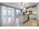 Bright, open kitchen featuring white cabinets, granite countertops, and stainless steel appliances at 5210 Davenport Pl, Roswell, GA 30075