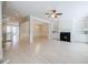 Open-concept living space featuring hardwood floors, fireplace, and view into the dining area at 5210 Davenport Pl, Roswell, GA 30075