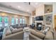 Bright living room featuring neutral walls, fireplace, built-in shelving, and ample seating at 5210 Davenport Pl, Roswell, GA 30075