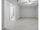 Bright, open living room with modern ceiling fan and bathroom access at 5210 Davenport Pl, Roswell, GA 30075