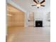 Spacious living room with fireplace, white built-ins, and open access to dining area at 5210 Davenport Pl, Roswell, GA 30075