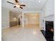 Expansive living room with hardwood floors, fireplace, and staircase access to upper level at 5210 Davenport Pl, Roswell, GA 30075