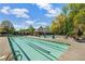 Relaxing community pool with lounge chairs and mature trees on a bright day at 5210 Davenport Pl, Roswell, GA 30075