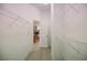 Spacious walk-in closet with wire shelving and wood-look flooring at 5210 Davenport Pl, Roswell, GA 30075