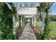 Charming walkway with beautiful greenery and flowers, creating a serene entrance at 5210 Davenport Pl, Roswell, GA 30075