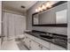 Bathroom with a large mirror, a shower with curtain, and a white and gray color scheme at 58 Basswood Cir # 29, Atlanta, GA 30328