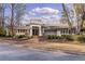 Exterior view of community clubhouse with manicured landscaping and welcoming entrance at 58 Basswood Cir # 29, Atlanta, GA 30328