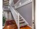 Bright foyer with hardwood floors, staircase, and view into adjacent hallway at 58 Basswood Cir # 29, Atlanta, GA 30328