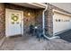 Charming front porch with stone accents, white door with wreath, and seating area at 58 Basswood Cir # 29, Atlanta, GA 30328