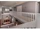 Modern upstairs hallway with bridge overlooking dinning room, stairs, and bedroom area at 58 Basswood Cir # 29, Atlanta, GA 30328