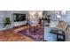 Cozy living room featuring hardwood floors, a plush sofa, and stylish decor at 58 Basswood Cir # 29, Atlanta, GA 30328