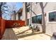 Inviting outdoor area with new wood deck, table, and seating surrounded by a privacy fence at 58 Basswood Cir # 29, Atlanta, GA 30328