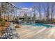 A community pool offers a refreshing retreat with ample deck space, and a handsome building in the background at 58 Basswood Cir # 29, Atlanta, GA 30328