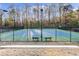 A community tennis court with lights and a fenced in area, perfect for exercise and recreation at 58 Basswood Cir # 29, Atlanta, GA 30328