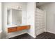 Modern bathroom features a floating vanity, large mirror, and tiled shower with decorative curtain at 1430 Dresden Ne Dr # 215, Atlanta, GA 30319