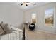 Bright bedroom features a large window, ceiling fan, a desk and neutral carpet at 1430 Dresden Ne Dr # 215, Atlanta, GA 30319