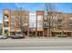 Street view of a brick building with multiple storefronts and residences at 1430 Dresden Ne Dr # 215, Atlanta, GA 30319