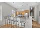 Modern kitchen with granite countertops, a breakfast bar with seating, stainless steel appliances, wooden cabinets, and hardwood floors at 1430 Dresden Ne Dr # 215, Atlanta, GA 30319