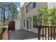 Wooden back deck featuring a light-colored home exterior and fenced yard area at 165 River Ridge Ln, Roswell, GA 30075
