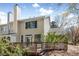 Exterior of home with a wooden back deck and fenced backyard at 165 River Ridge Ln, Roswell, GA 30075