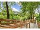 Scenic boardwalk with natural landscaping and mature trees at 165 River Ridge Ln, Roswell, GA 30075