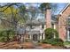 Charming two-story traditional home with brick accents, a well-manicured front yard, and a welcoming entrance at 165 River Ridge Ln, Roswell, GA 30075