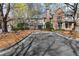 Attractive two-story home with a well-maintained yard and a paved driveway at 165 River Ridge Ln, Roswell, GA 30075