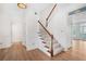 Welcoming foyer with a staircase, hardwood floors, and ample natural light at 165 River Ridge Ln, Roswell, GA 30075