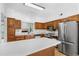 Well-appointed kitchen featuring stainless steel appliances, a center island, and ample counter space for meal preparation at 165 River Ridge Ln, Roswell, GA 30075