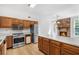 Charming kitchen with modern appliances, a center island and views of the breakfast area at 165 River Ridge Ln, Roswell, GA 30075