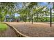 Outdoor playground featuring slides, climbing structures, and swings, provides fun for  at 165 River Ridge Ln, Roswell, GA 30075