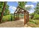 River walk with a wooden bridge and arbor at 165 River Ridge Ln, Roswell, GA 30075