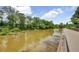 Scenic view of the Chattahoochee River with a walkway in a community with a nature-filled outdoor environment at 165 River Ridge Ln, Roswell, GA 30075