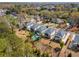 Aerial view features the neighborhood's beautiful homes, lush green landscaping, and a community pool at 2033 Lee Se Rd, Smyrna, GA 30080
