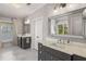 Elegant bathroom featuring marble floors, double vanities, and a large framed mirror at 2033 Lee Se Rd, Smyrna, GA 30080