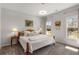 Cozy bedroom with plush carpet, a decorative accent wall, and ample natural light at 2033 Lee Se Rd, Smyrna, GA 30080
