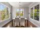 A bright dining room with large windows and natural light overlooking the scenic outdoors at 2033 Lee Se Rd, Smyrna, GA 30080