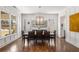 Bright and airy dining room with hardwood floors and a large window allowing for natural light at 2033 Lee Se Rd, Smyrna, GA 30080