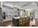 Bright, open kitchen featuring a large island, stainless steel appliances, and hardwood floors at 2033 Lee Se Rd, Smyrna, GA 30080