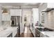 This gourmet kitchen features stainless steel appliances, sleek countertops, and a modern design at 2033 Lee Se Rd, Smyrna, GA 30080